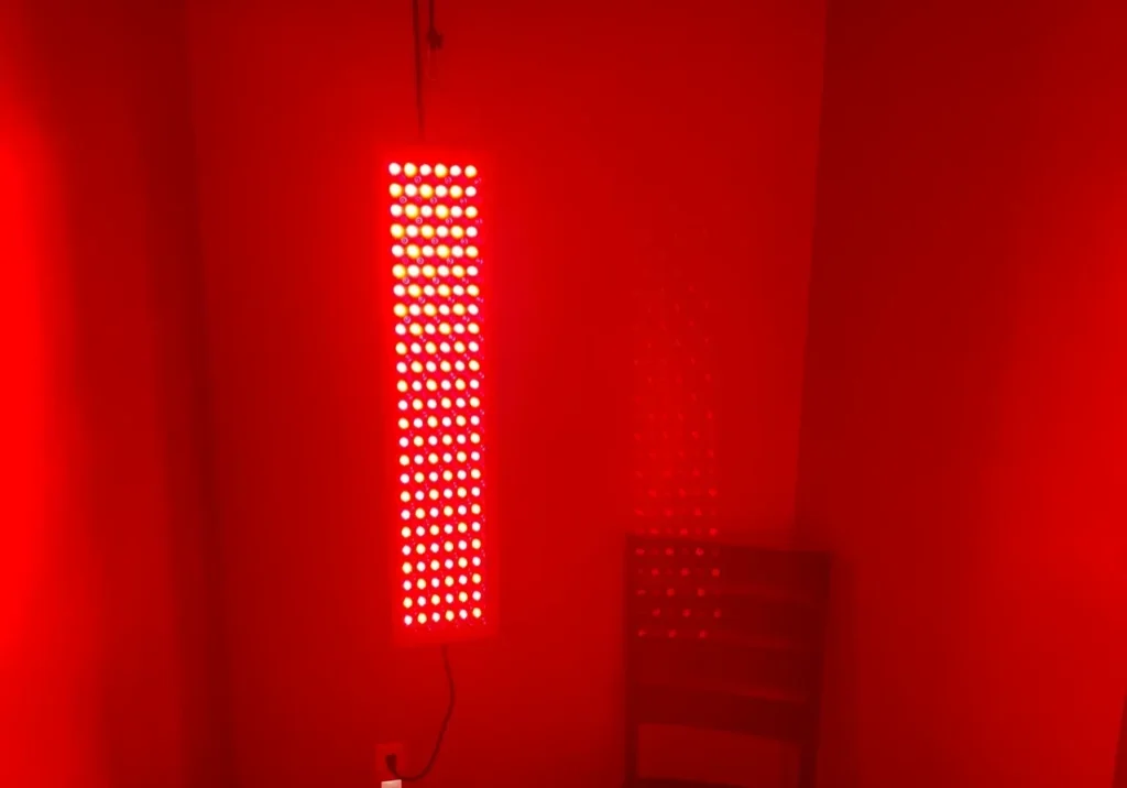 Vertical red LED light panel in room